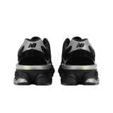 New Balance 9060 nere viste da dietro, tallone con logo N grigio